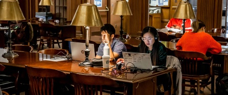 Students studying in Abbott Library's Austin Flint Reading Room. 