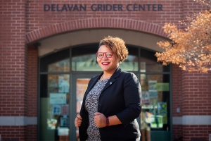 Dr. Monica Miles in front of the Delavan Grider Center. 