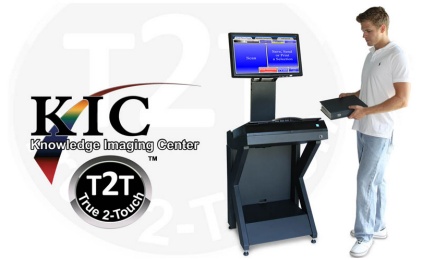 Photo of a man using the KIC scanner to scan pages of a book. 