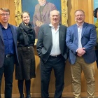 (From left) Scott Hollander, Alison Fraser, Colm Tóibín, James Maynard, and Barbara Cole stand before a portrait of James Joyce’s father by Patrick Tuohy. 