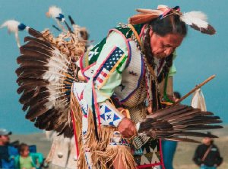 Native American man in traditional dress. 