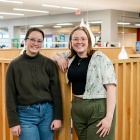 Lilly (left) and Hayden Radel pose in Silverman Library. 