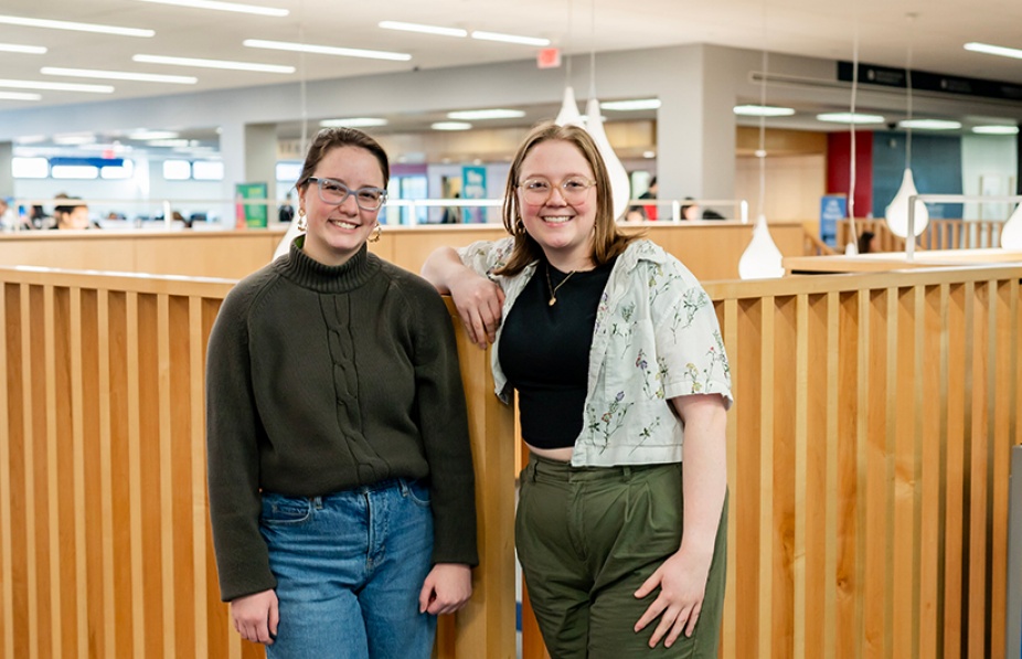 Lilly (left) and Hayden Radel pose in Silverman Library. 