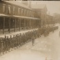 In black and white, the United States of America General Hospital Number 4. Quartermaster and Medical Detachment in front of the hospital building. 