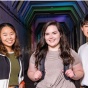 Three smiling students. 