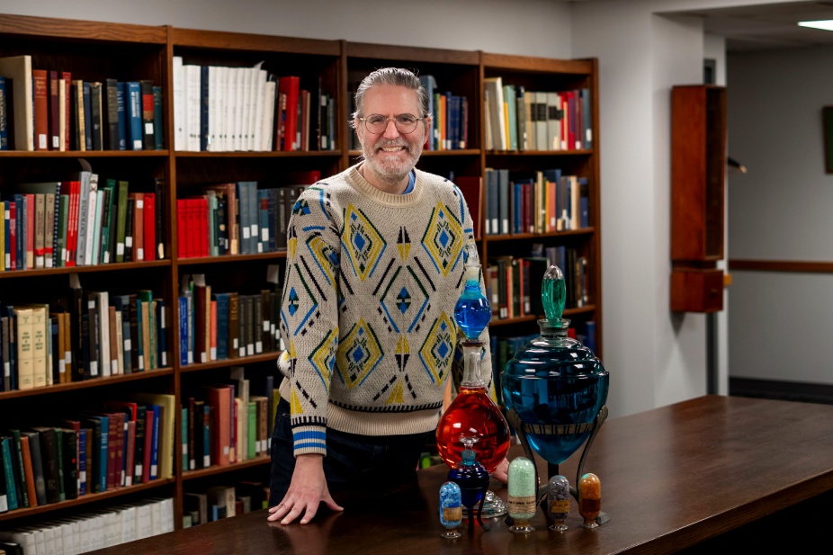 Keith Mages, History of Medicine Curator with apothecary show globes. 