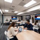 UB community members collaborate in a newly designed meeting space. 