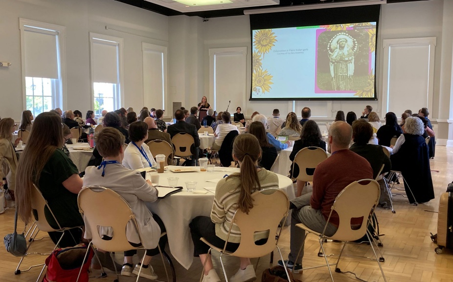Attendees gather in Harriman Hall for the annual meeting.