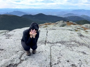 Leslie Feldballe on top of Mount Marcy, the highest elevation in New York State, standing at 5,344 feet. 